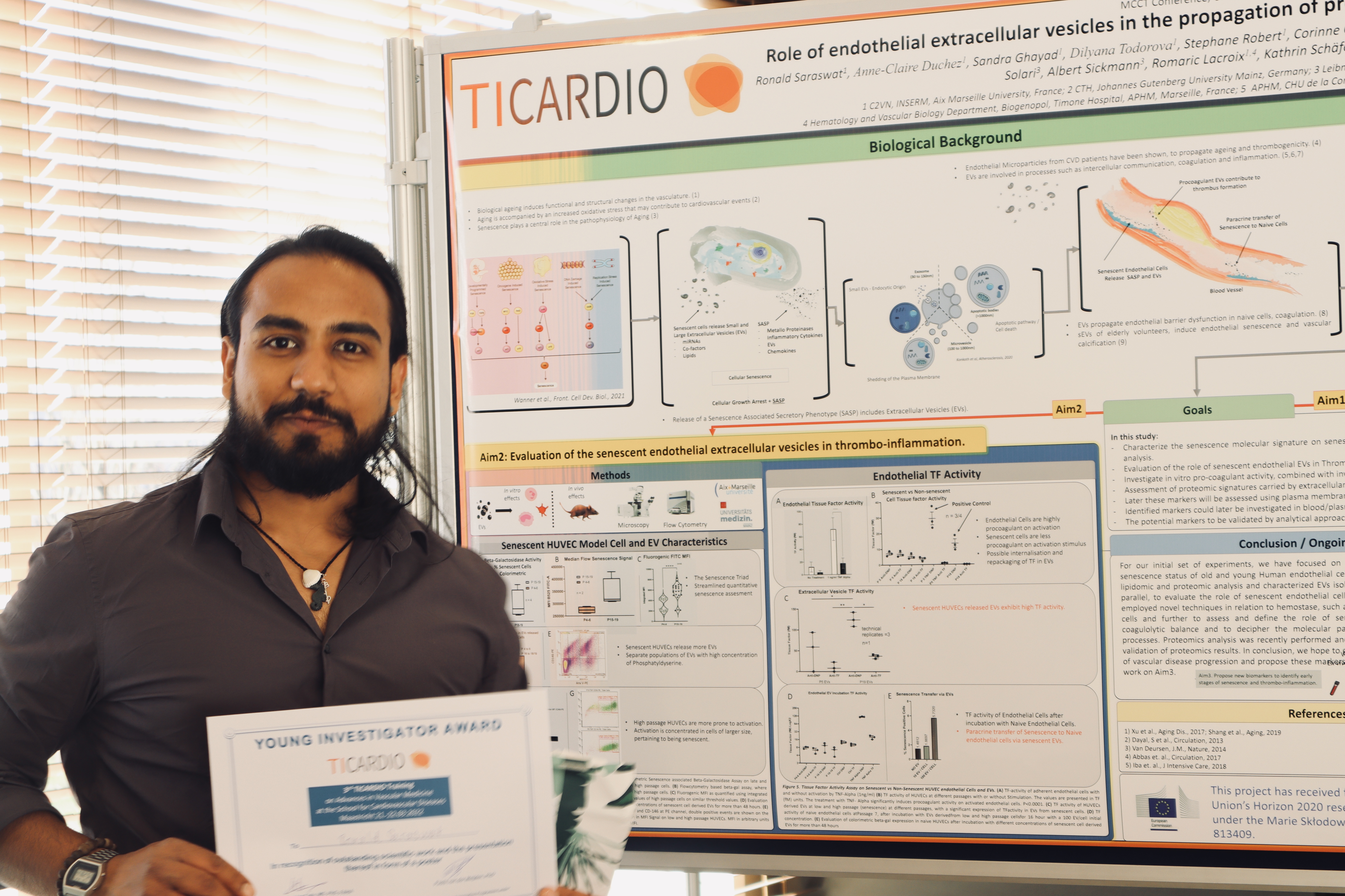 Ronald Saraswat with his poster and Young Investigator Award