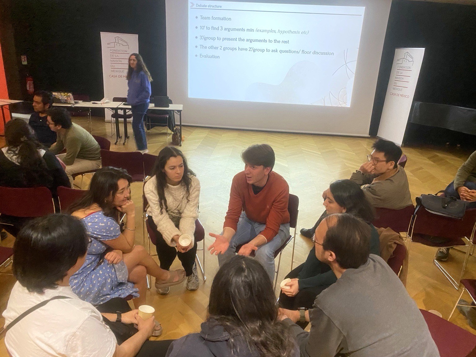 Participants taking part in a small-group discussion during a Gene & Tonic event